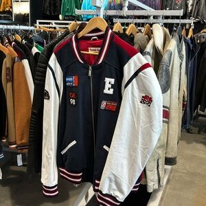 Varsity jacket with patches and leather sleeves